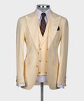 Cream suit jacket with matching vest, brown polka-dot tie, white shirt
