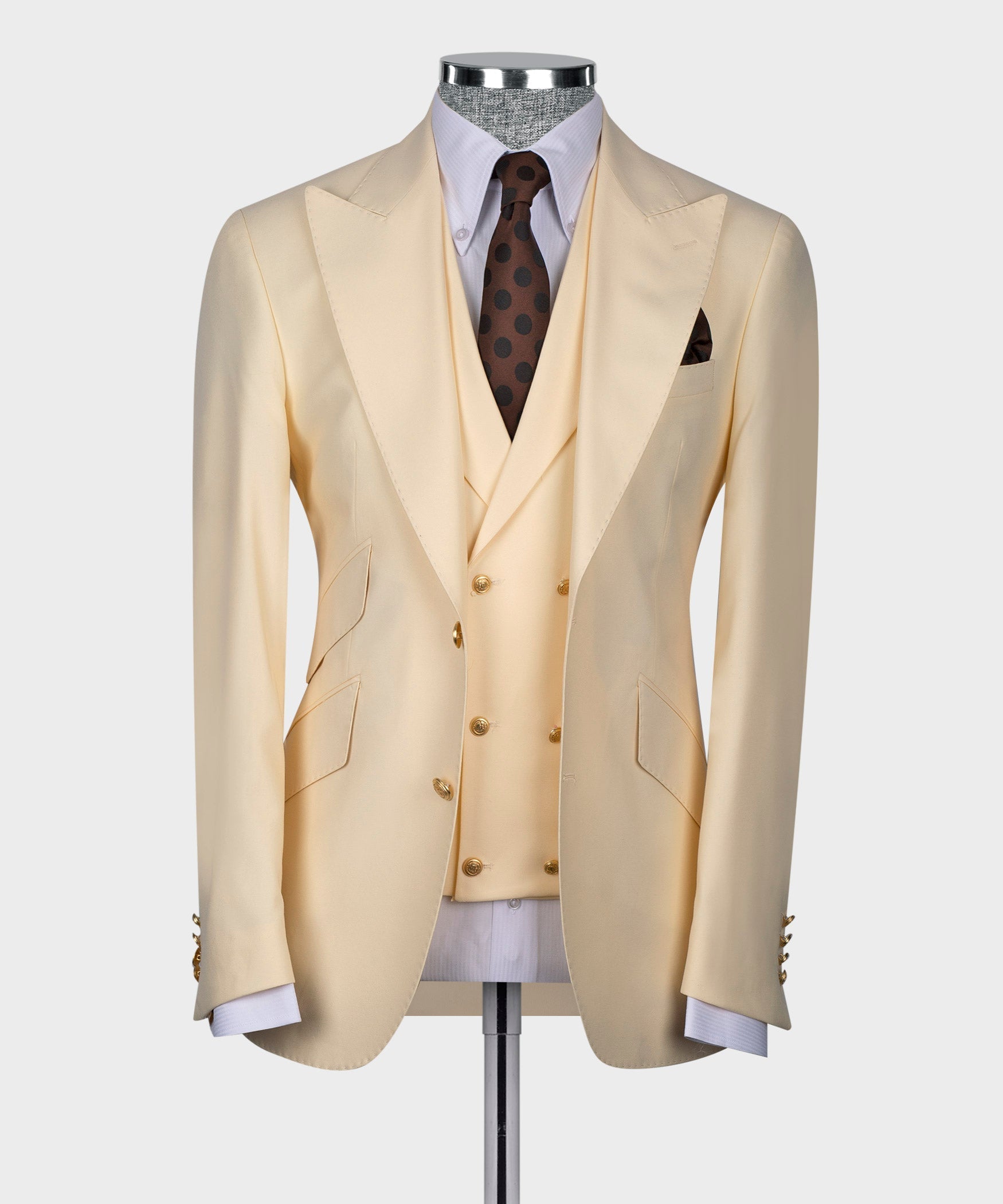 Cream suit jacket with matching vest, brown polka-dot tie, white shirt