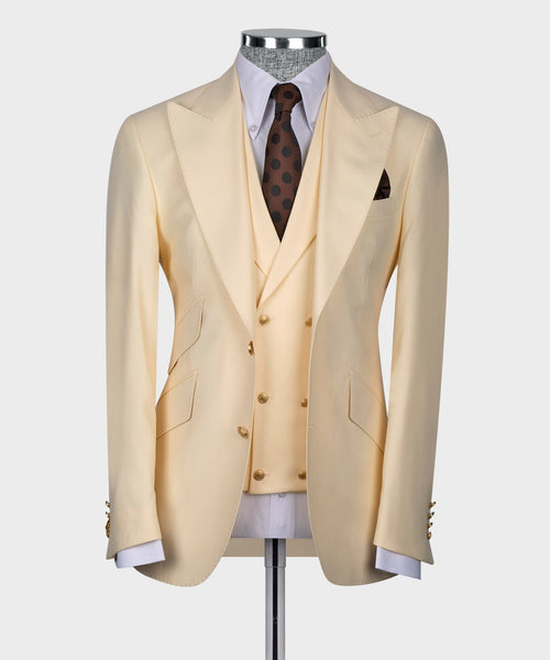 Cream suit jacket with matching vest, brown polka-dot tie, white shirt