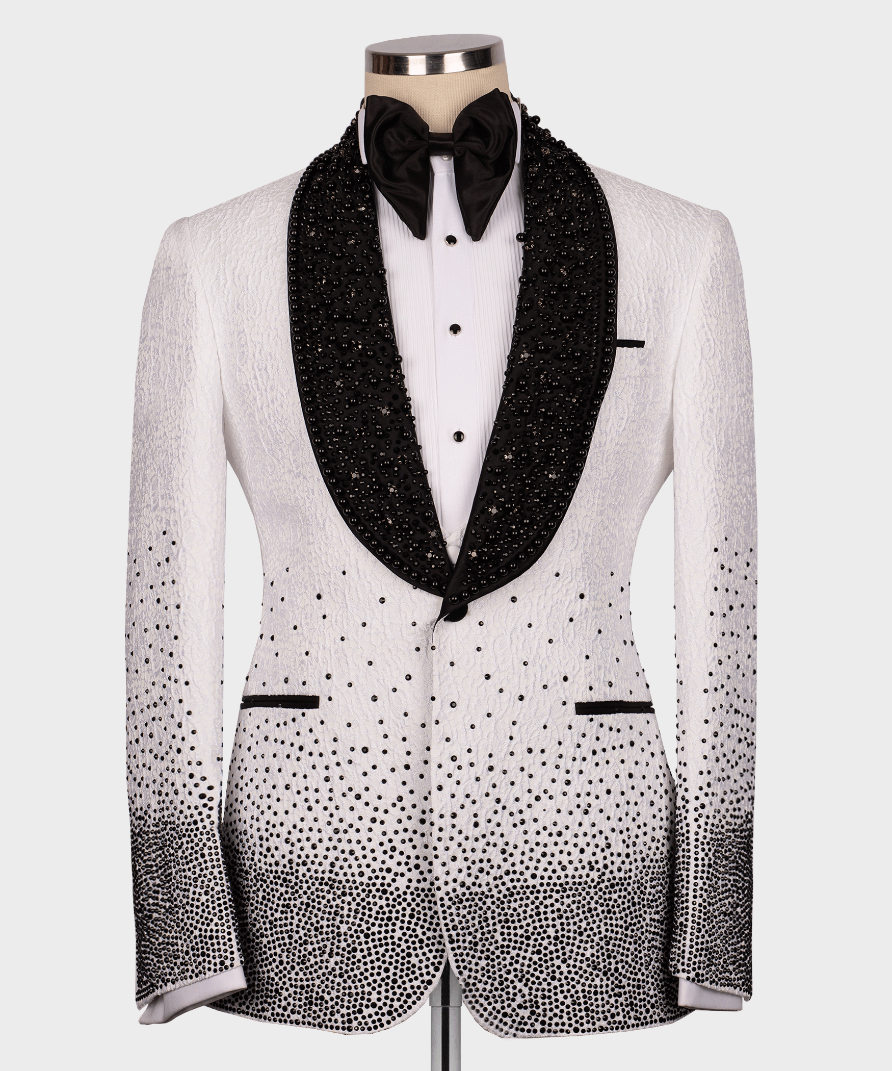 Black and white tuxedo jacket with gem-studded satin lapels and black bow tie
