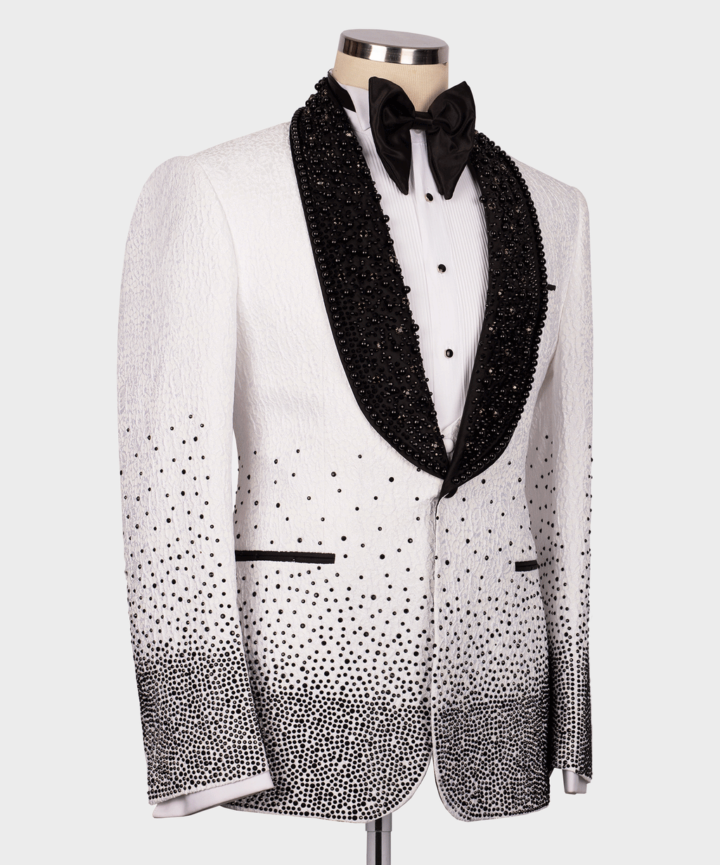 White tuxedo jacket front with black bow tie, gem-studded lapels, and dotted pattern
