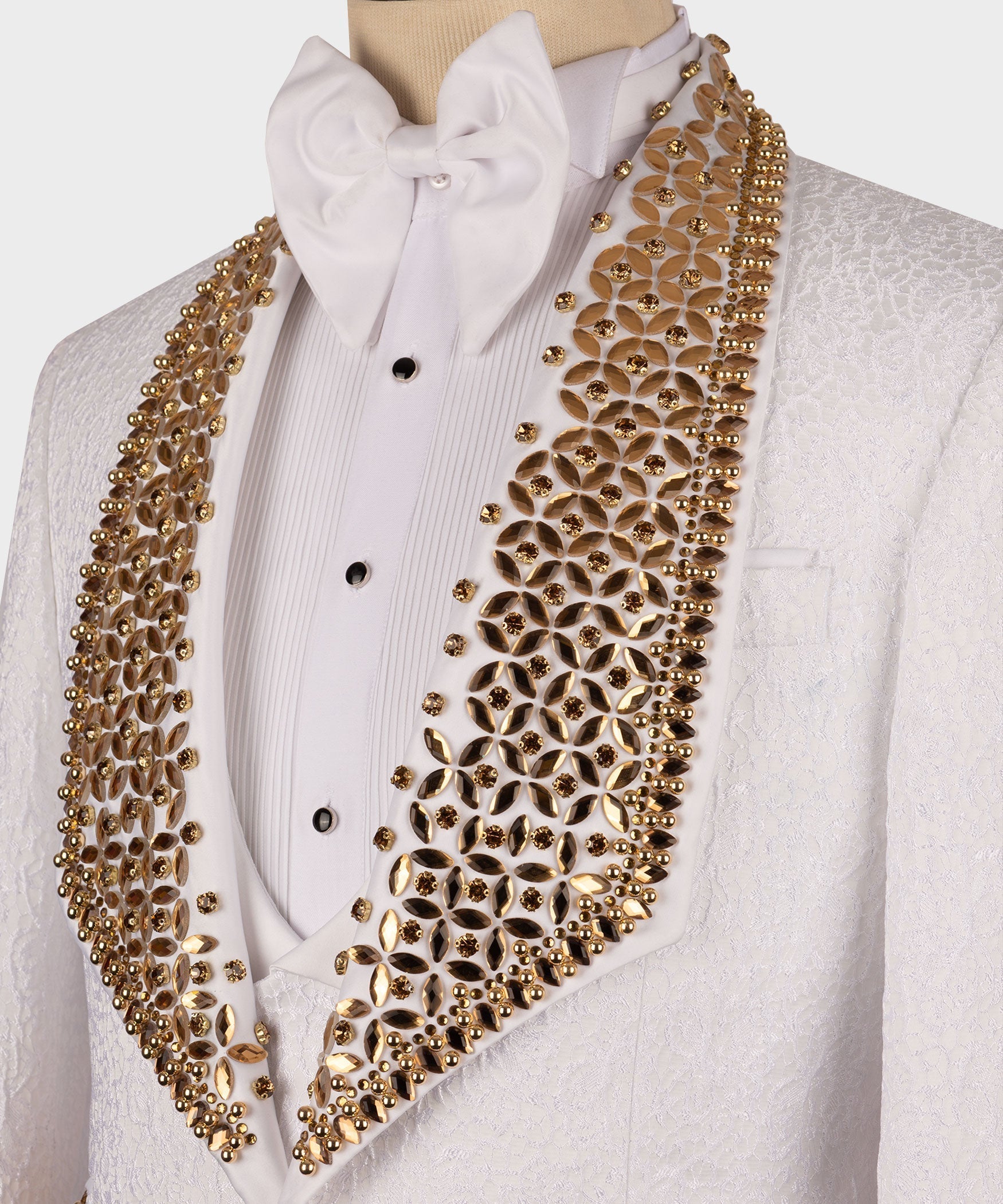 Close-up white dress shirt and bow tie with gold gem-stone V-shaped trim
