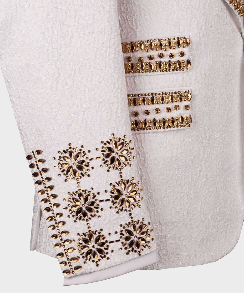 White tuxedo jacket with gold gem-stone buttons and sparkling lower trim