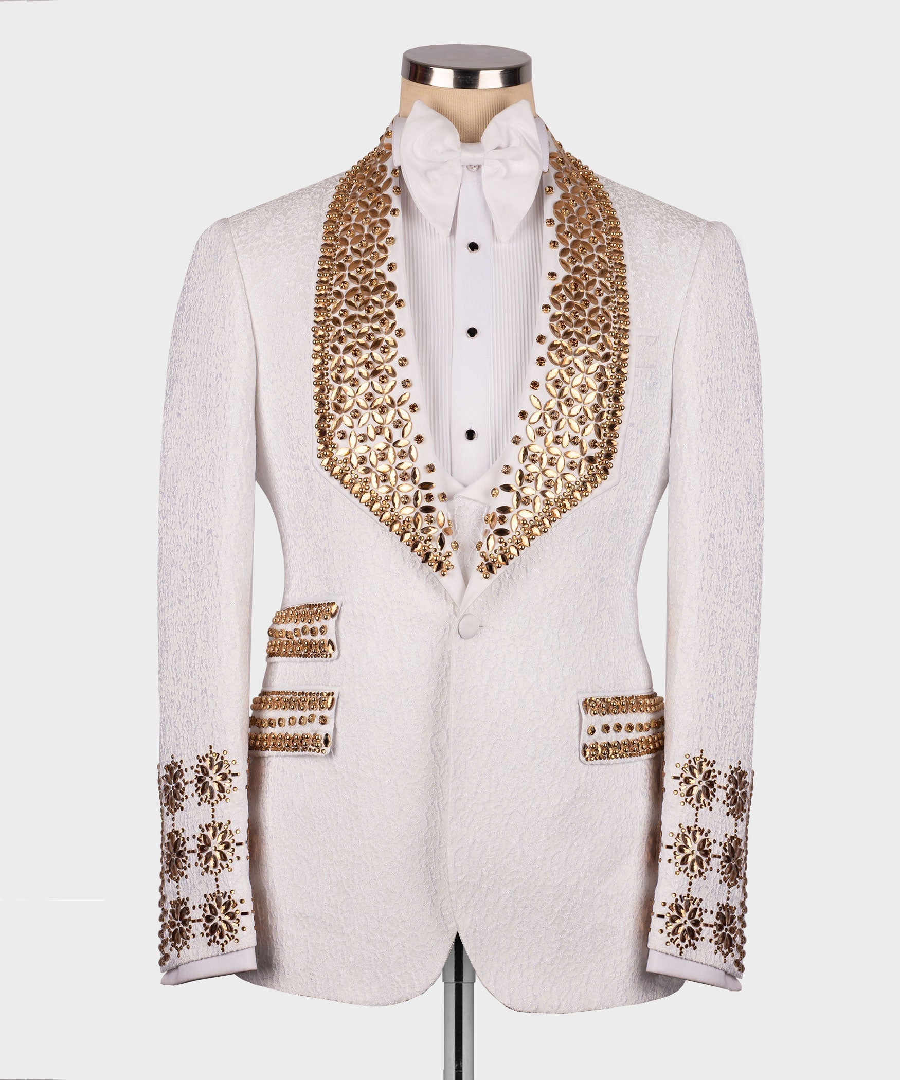 White tuxedo jacket with gold gem-stone embellishment, white bow tie and vest