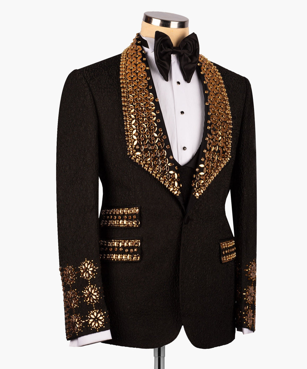 Black tuxedo jacket with ornate gold bead trim; studded cuffs and rectangular epaulets