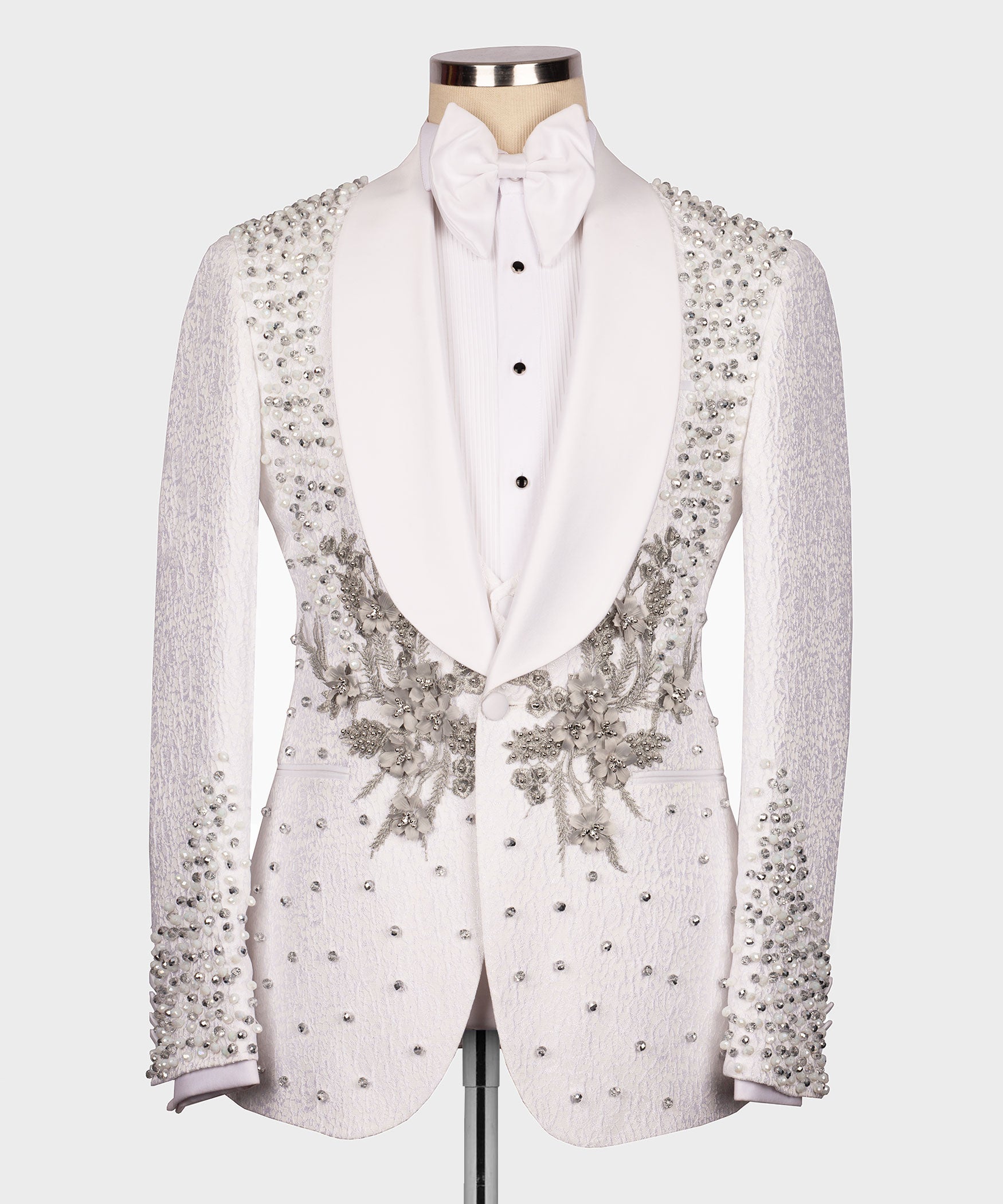 White tuxedo jacket with jeweled floral embellishments, black buttons, vest and bow tie set