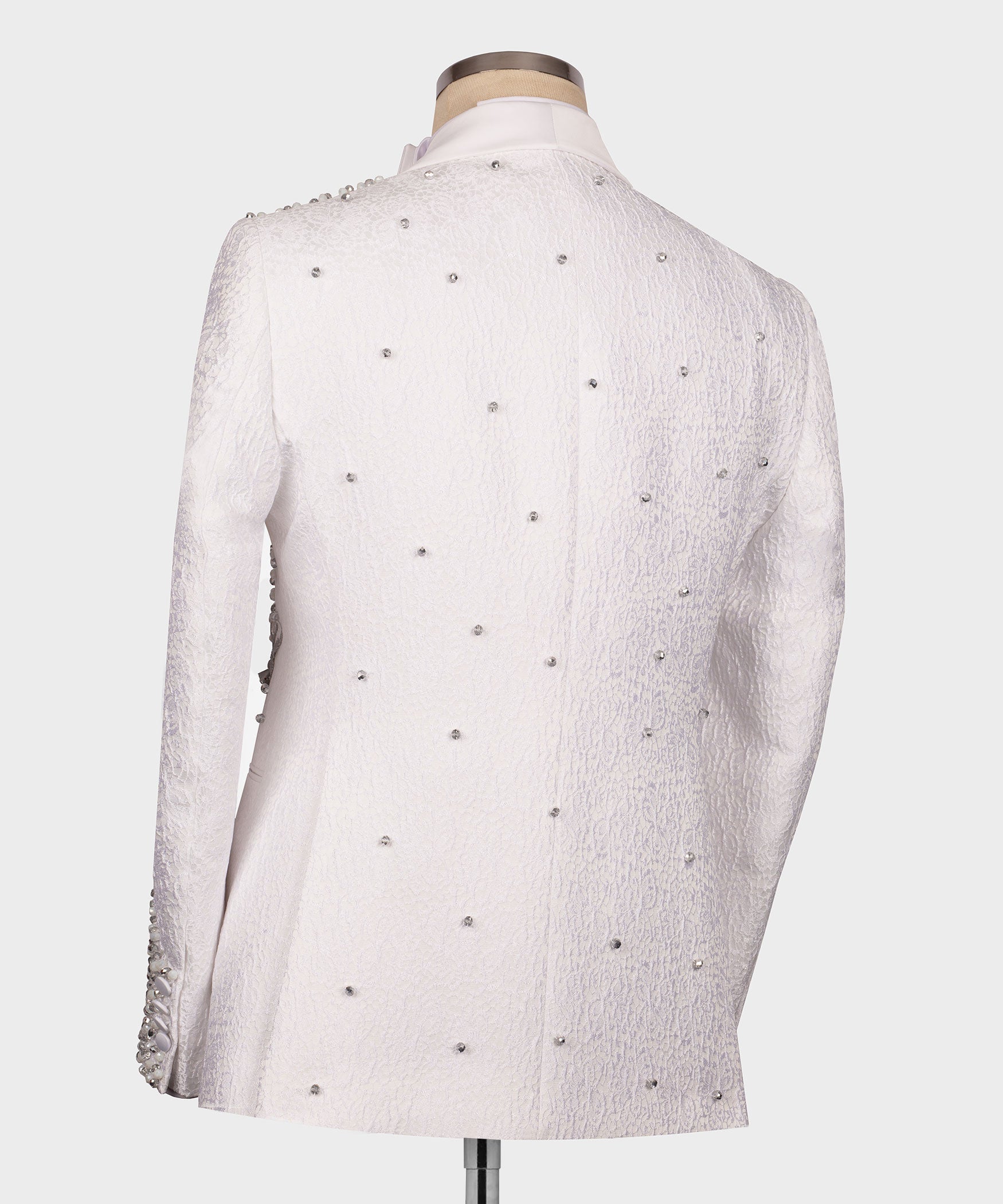 Back view of white tuxedo jacket covered in small rhinestones