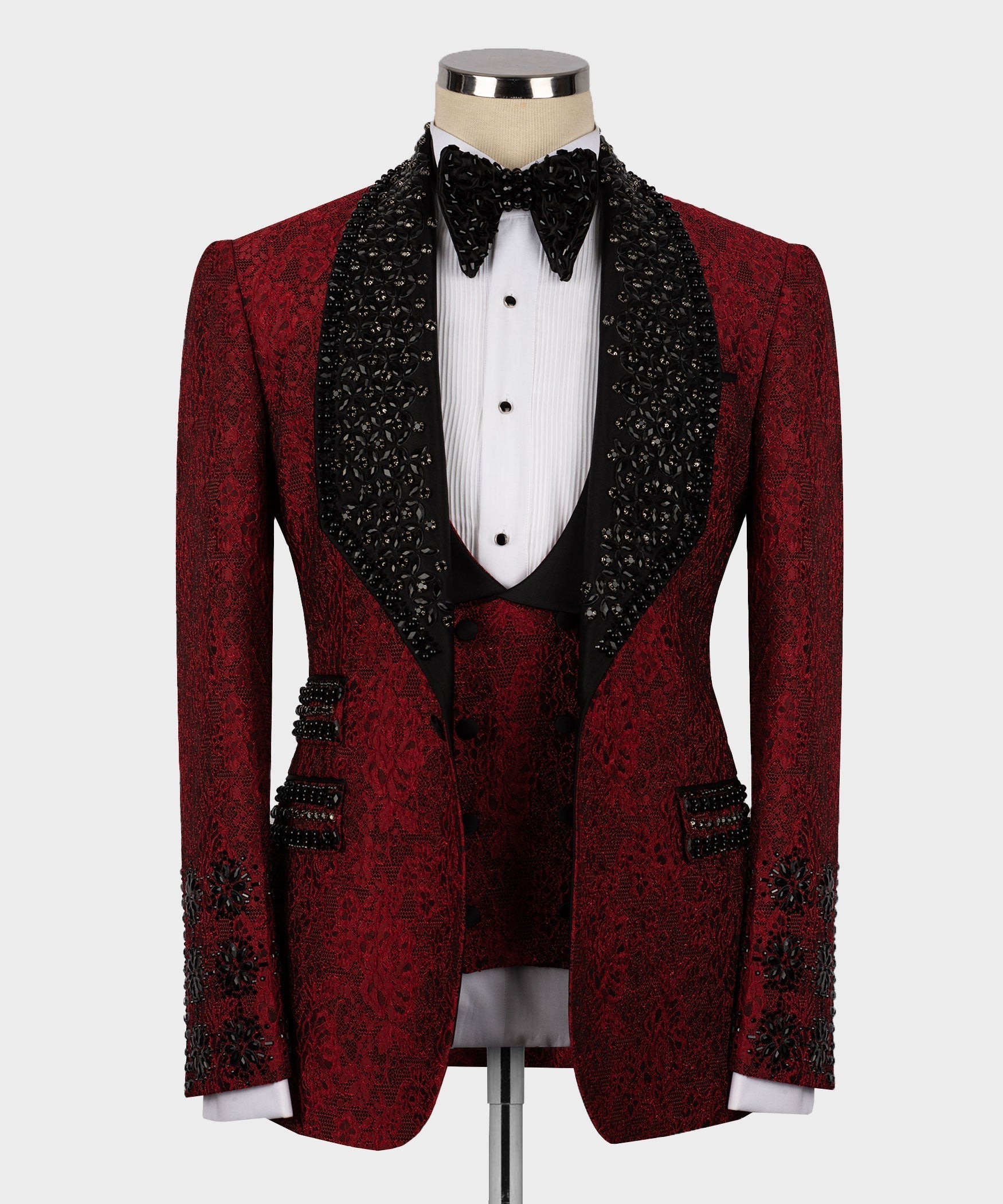 Front view red tuxedo with black waistcoat, white dress shirt, and bow tie