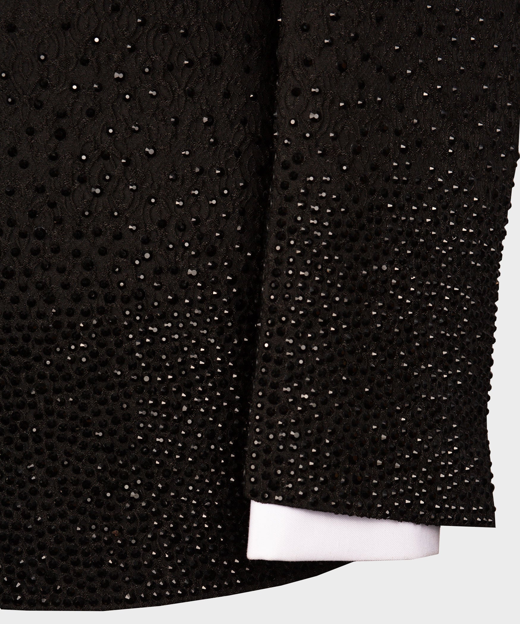 Black tuxedo jacket with dense rhinestone studded fabric panels on the lapel