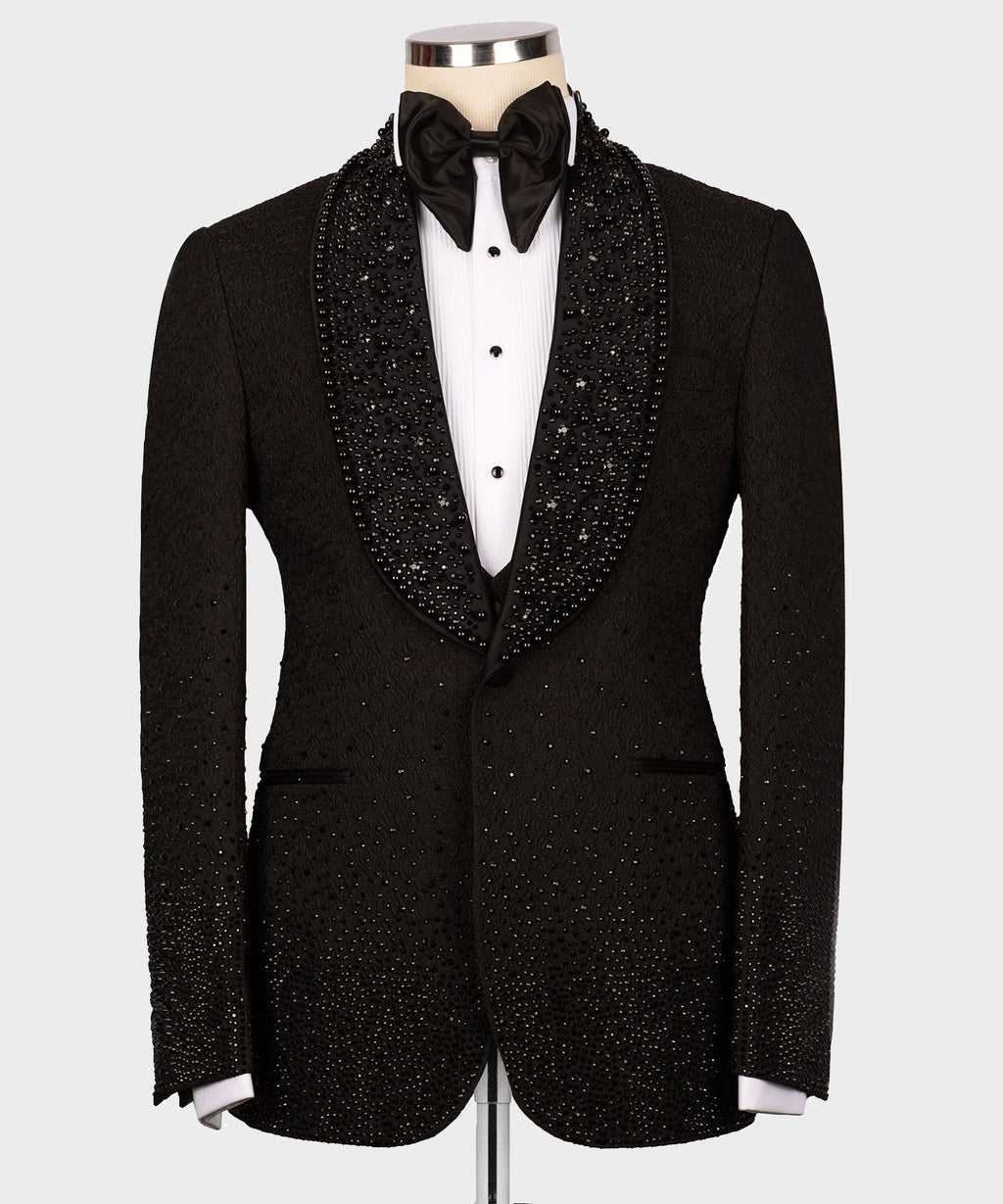 Black tuxedo jacket with rhinestone lapels, bow tie, and white dress shirt