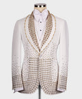 White tuxedo jacket with gold gem-stone trim, bow tie, and matching pocket detail