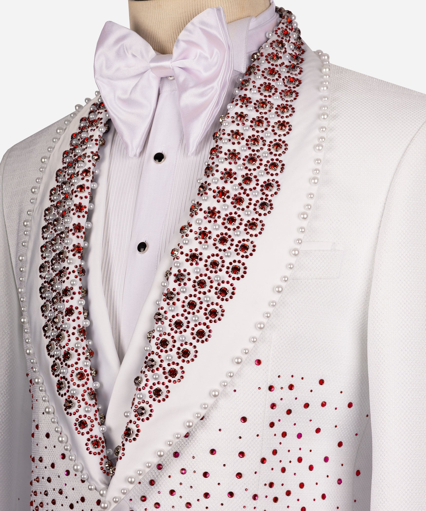 Close-up: white tuxedo shirt and bow tie with red gem beaded lapel trim