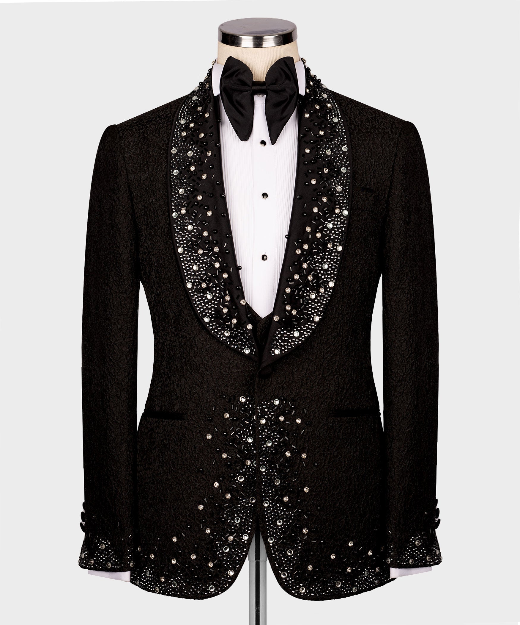 Black tuxedo suit: jeweled lapels, embellished waistcoat, black bow tie