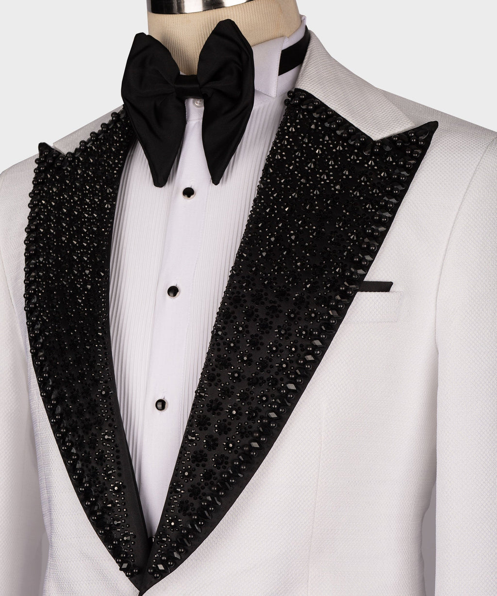 Close-up white shirt and black sequin lapels with large black bow tie
