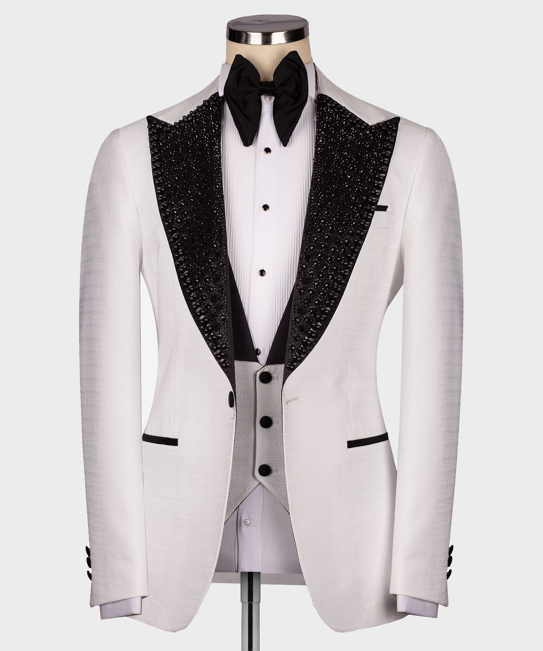 Front view white tuxedo jacket with black sequin lapels, white shirt, black bow tie