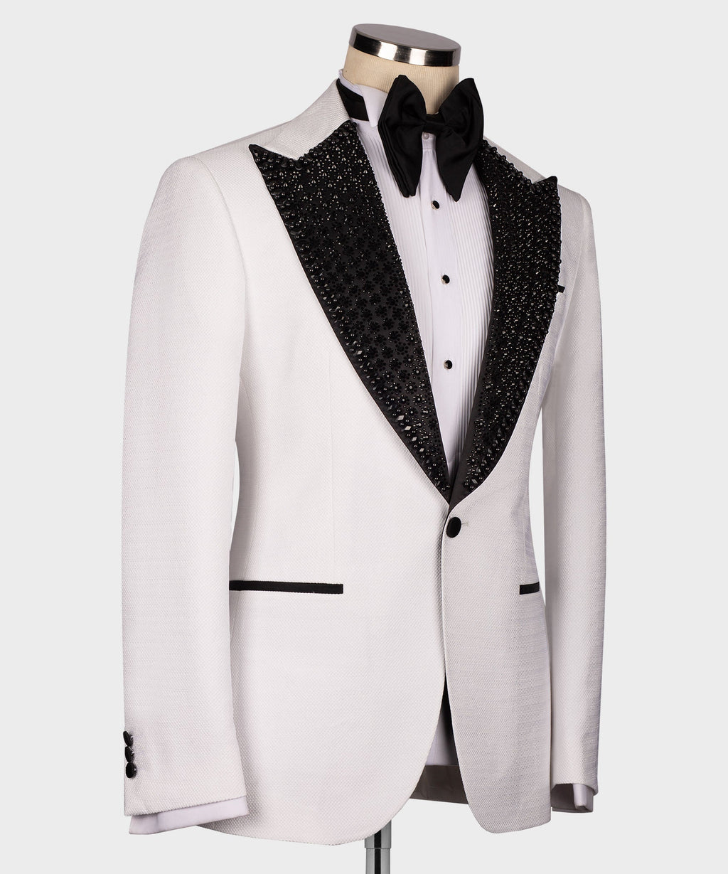 White tuxedo jacket with black glitter lapel trim and black bow tie, side angle