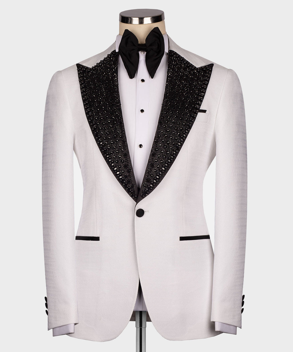White tuxedo jacket with black jeweled-sequin satin lapels and black bow tie