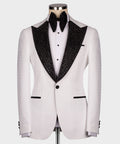 White tuxedo jacket with black jeweled-sequin satin lapels and black bow tie