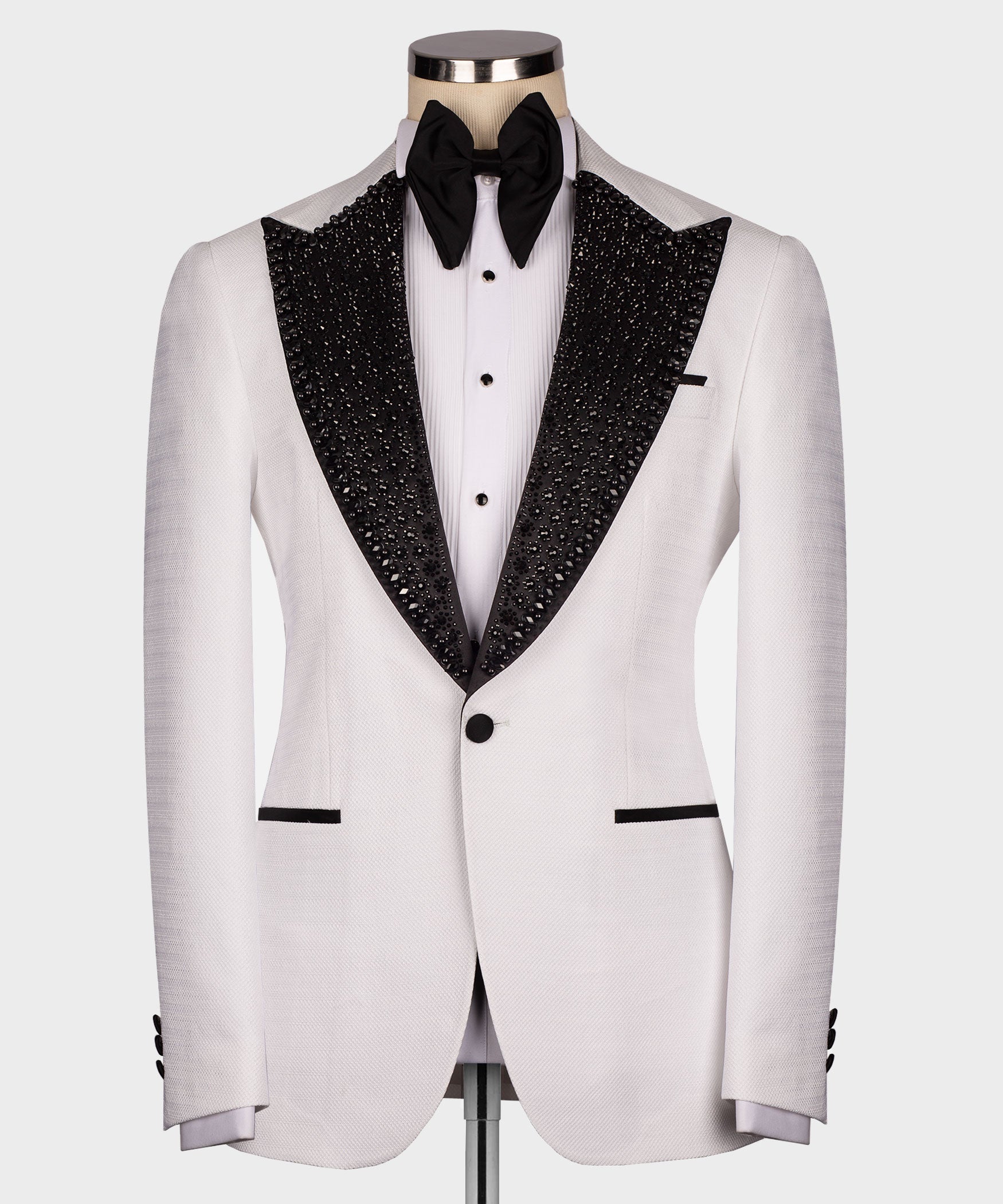 White tuxedo jacket with black jeweled-sequin satin lapels and black bow tie