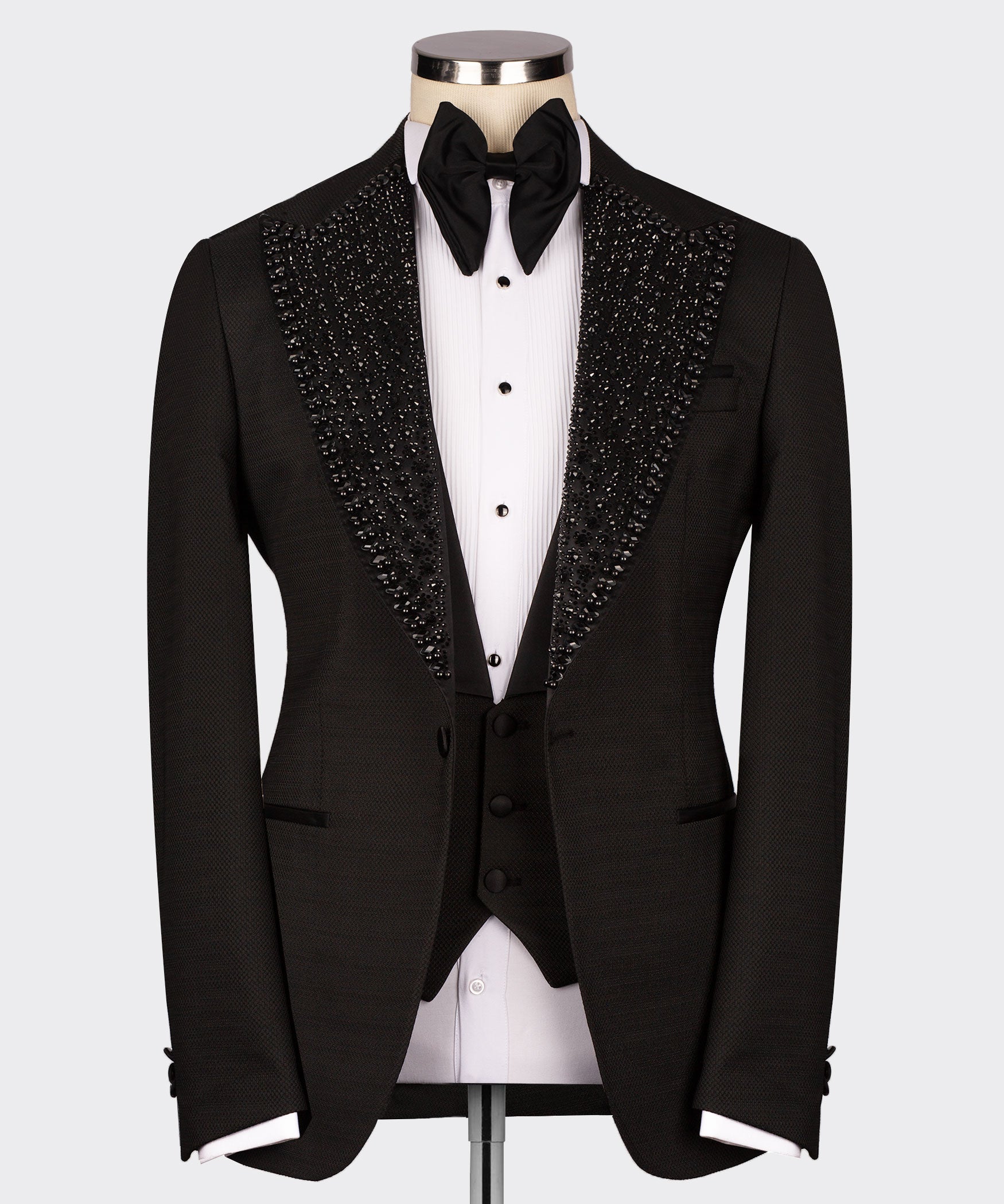 Black tuxedo vest and jacket with button front, jeweled shawl lapel, black bow tie