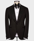 Black tuxedo jacket with gem-stone embellished shawl lapel and black bow tie