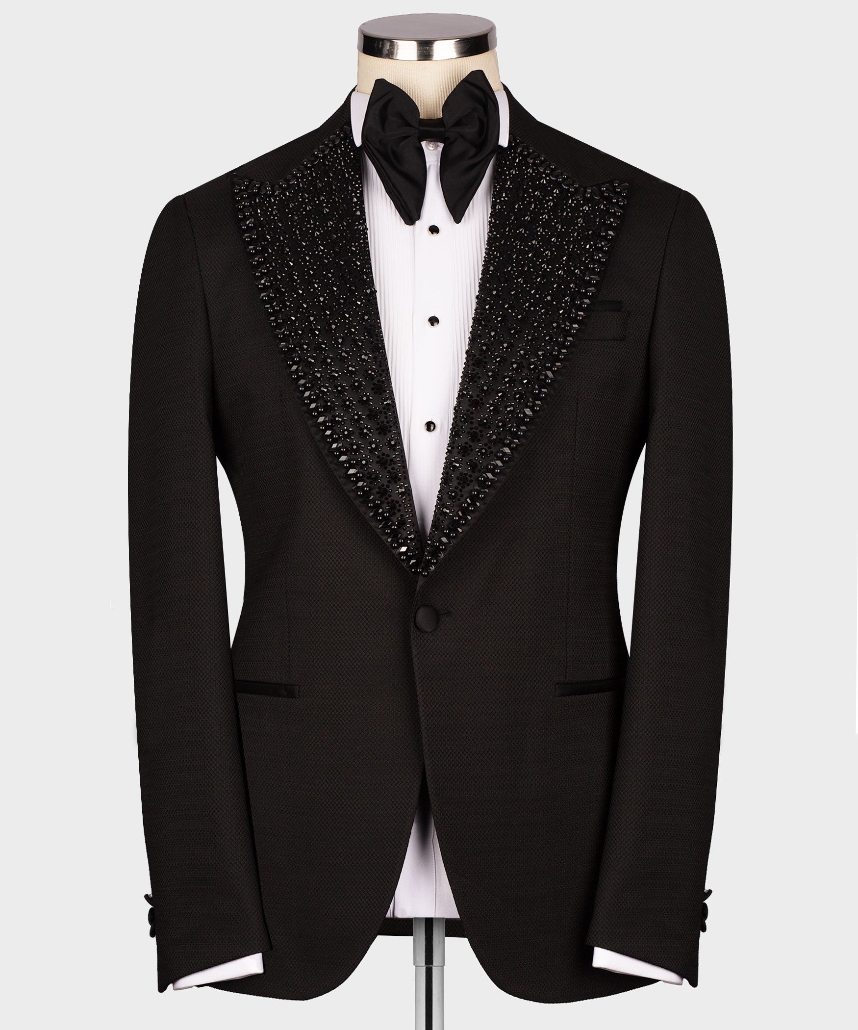 Black tuxedo jacket with gem-stone embellished shawl lapel and black bow tie