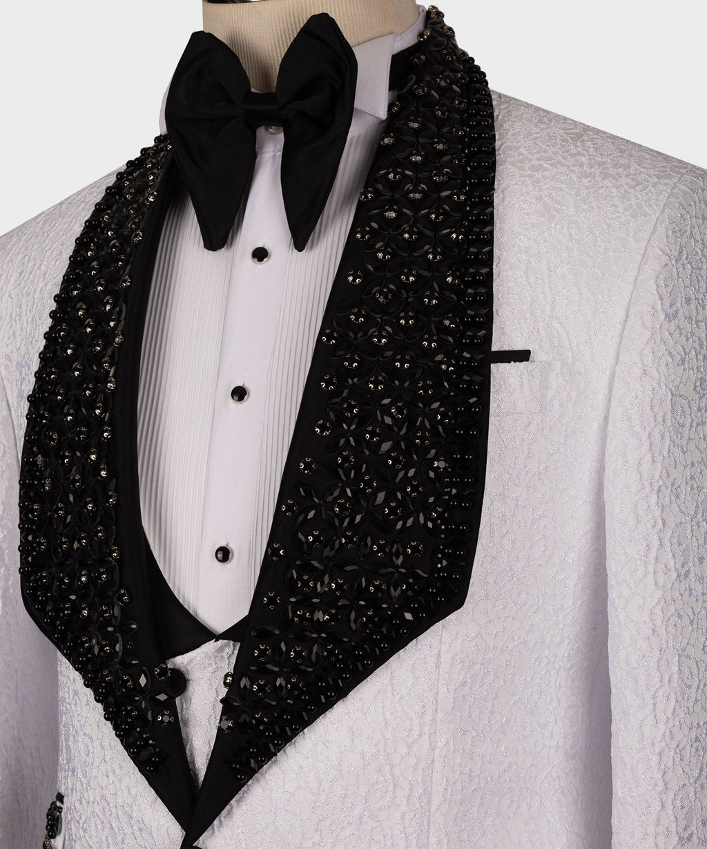 Close-up of white tuxedo jacket showing black crystal-covered lapel panels