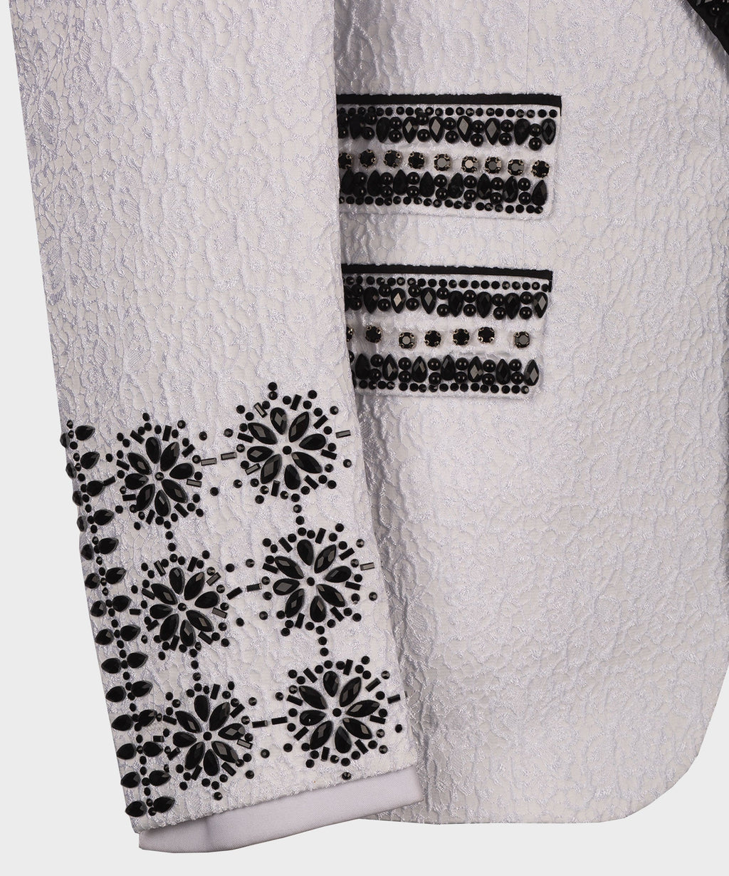 White tuxedo sleeve with black crystal floral appliqué and two horizontal jeweled bands