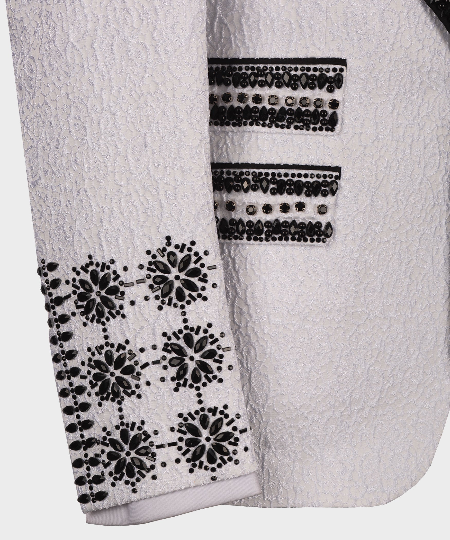 White tuxedo sleeve with black crystal floral appliqué and two horizontal jeweled bands