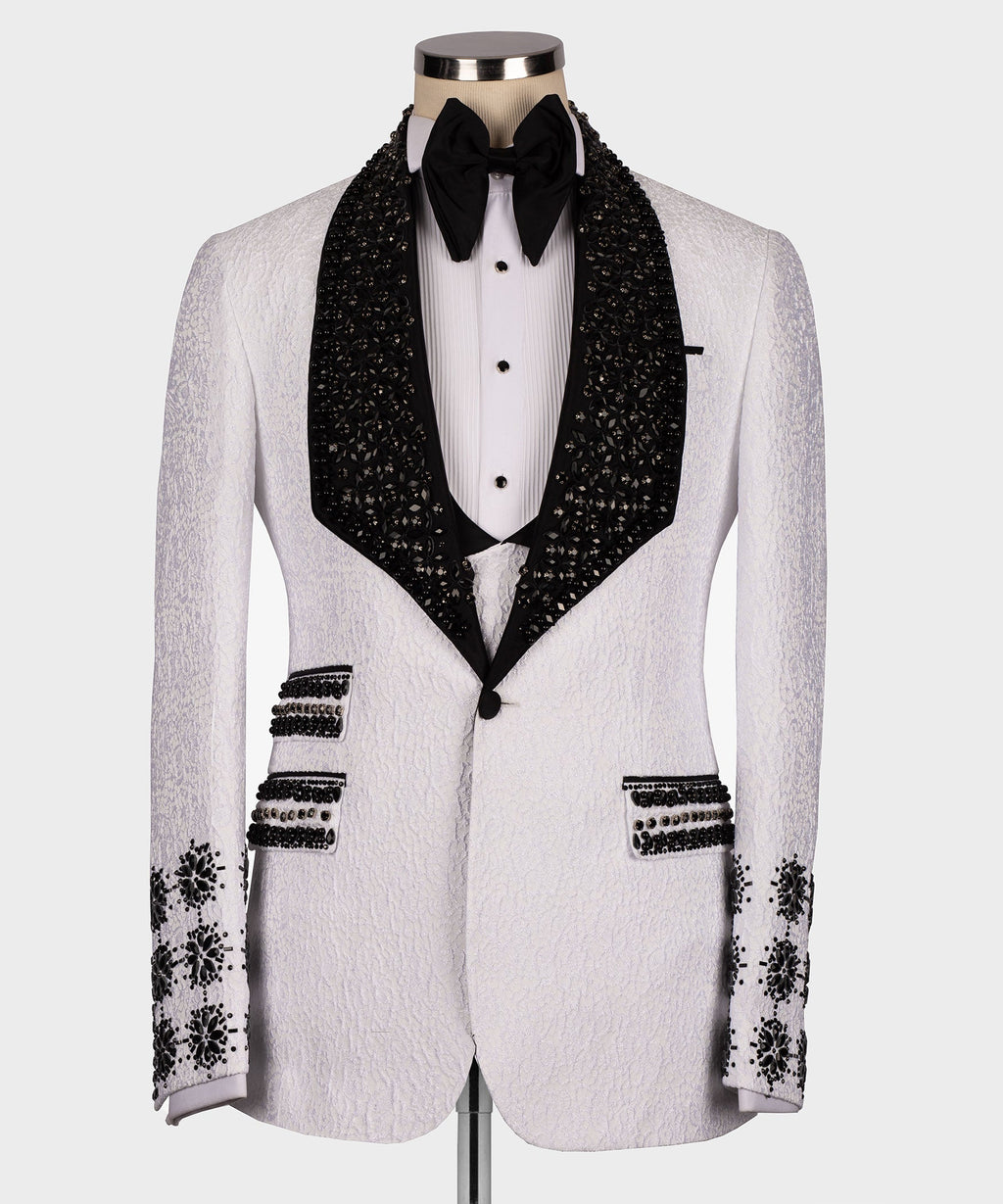 White tuxedo jacket with black gem-studded lapels and crystal button details