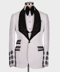 White tuxedo jacket with black gem-studded lapels and crystal button details