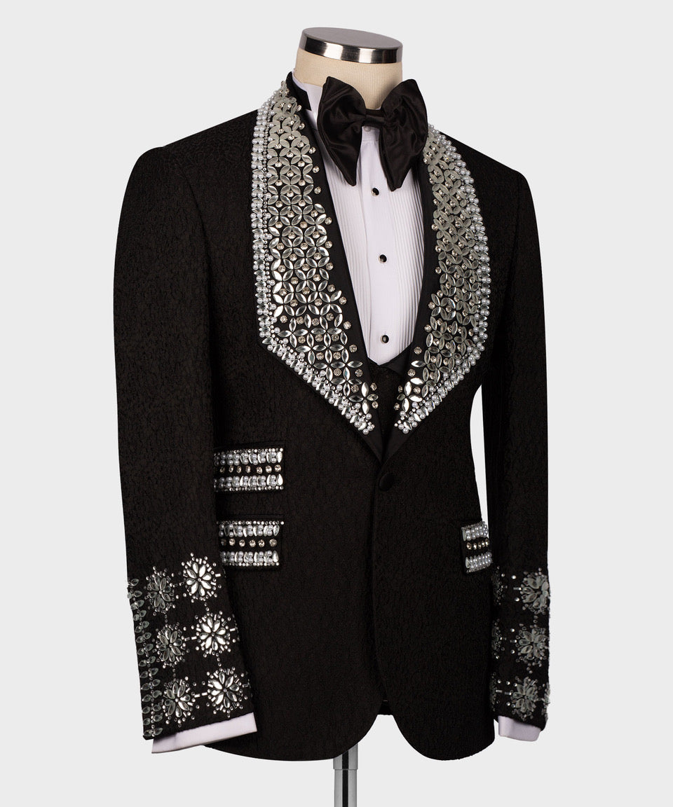 Black tuxedo jacket with rhinestone lapel trim, shirtfront buttons, and studded cuffs