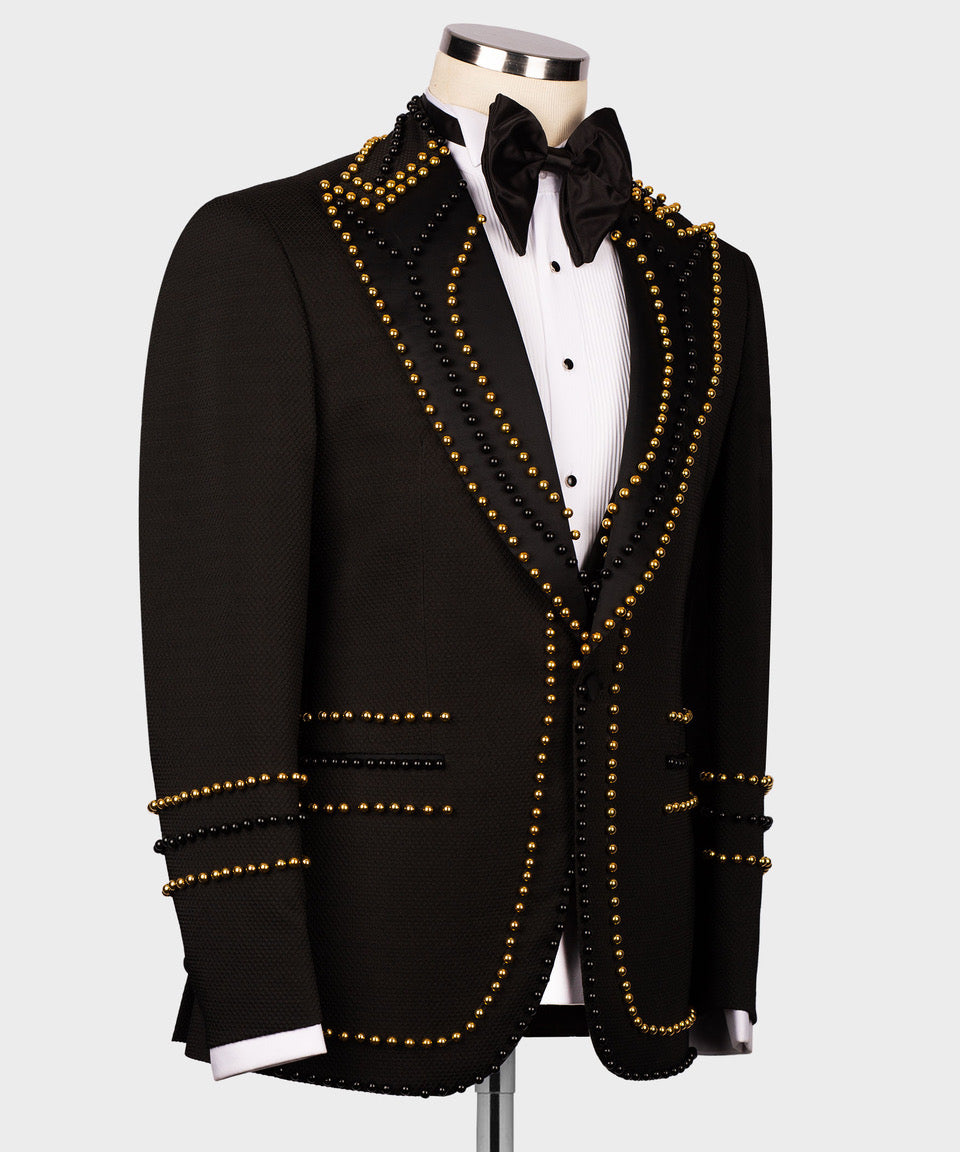 Black tuxedo jacket angled view with gold pearl and black bead trim along lapels