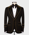Black tuxedo jacket with gold pearl trim V-lapel, matching bow tie and white shirt front