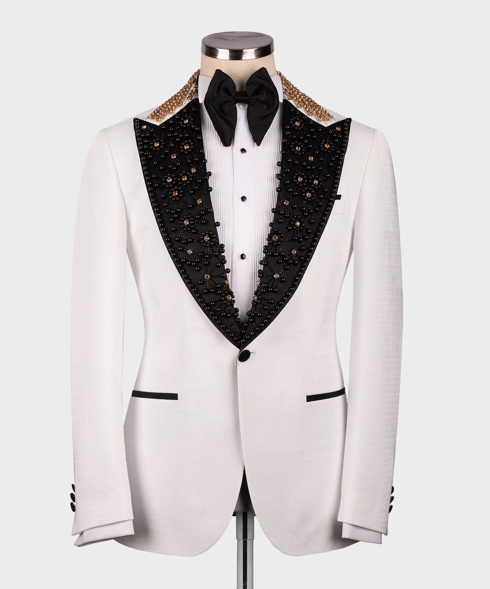 White tuxedo jacket with black embellished lapels, gold trim, bow tie, full front view