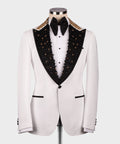 White tuxedo jacket with black embellished lapels, gold trim, bow tie, full front view