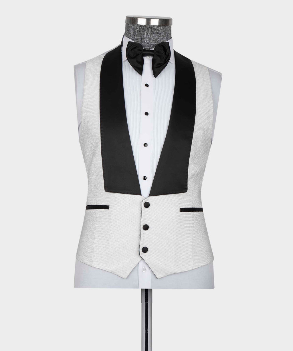 White tuxedo vest and jacket with black satin lapel accents and bow tie