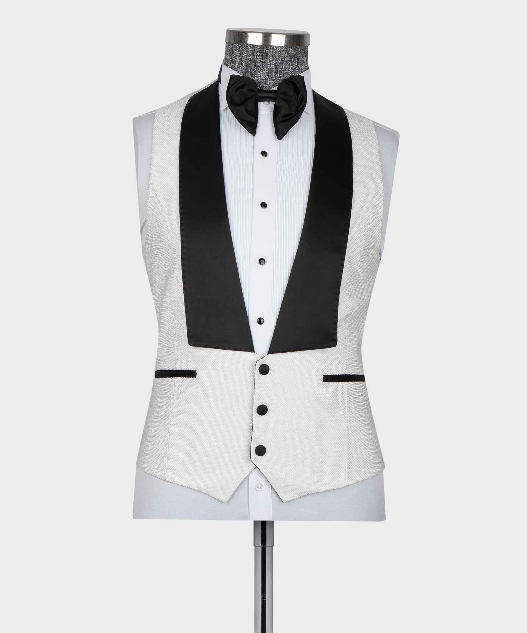 White tuxedo vest and jacket with black satin lapel accents and bow tie