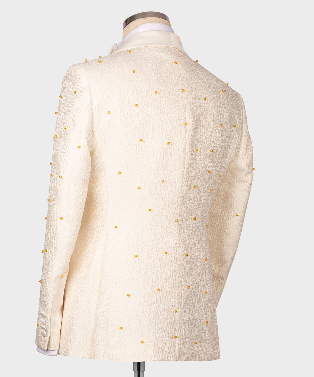 Back view of cream tuxedo jacket with scattered gold dot embellishments