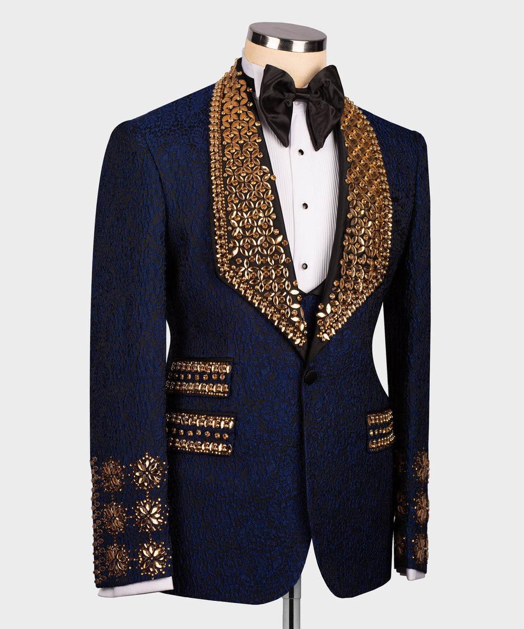 Navy tuxedo jacket with gold embroidered trim, cuff buttons, and black bow tie