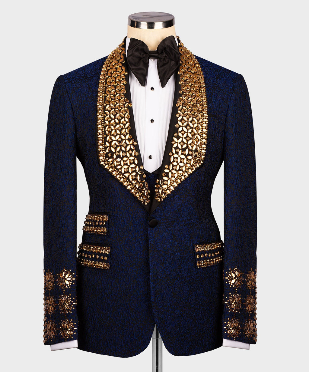 Dark navy tuxedo jacket with gold embellished lapels and black bow tie