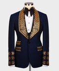 Dark navy tuxedo jacket with gold embellished lapels and black bow tie