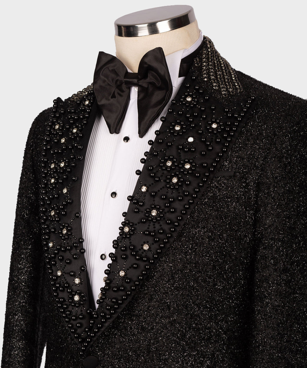Close-up black tuxedo lapel and waistcoat with dense crystal bead embellishment