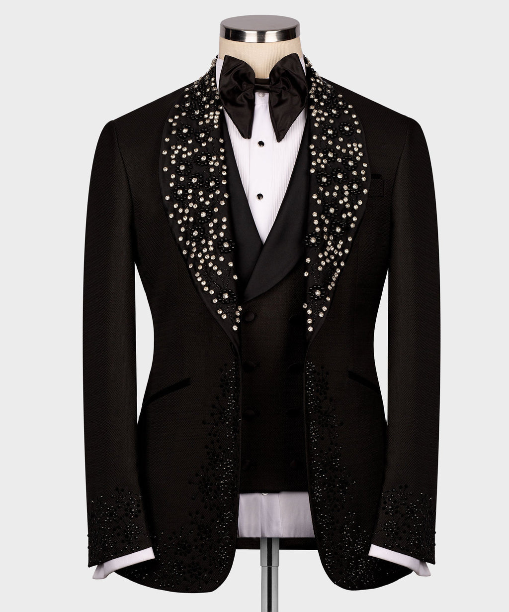 Black tuxedo set with rhinestone lapels, black bow tie, and vest