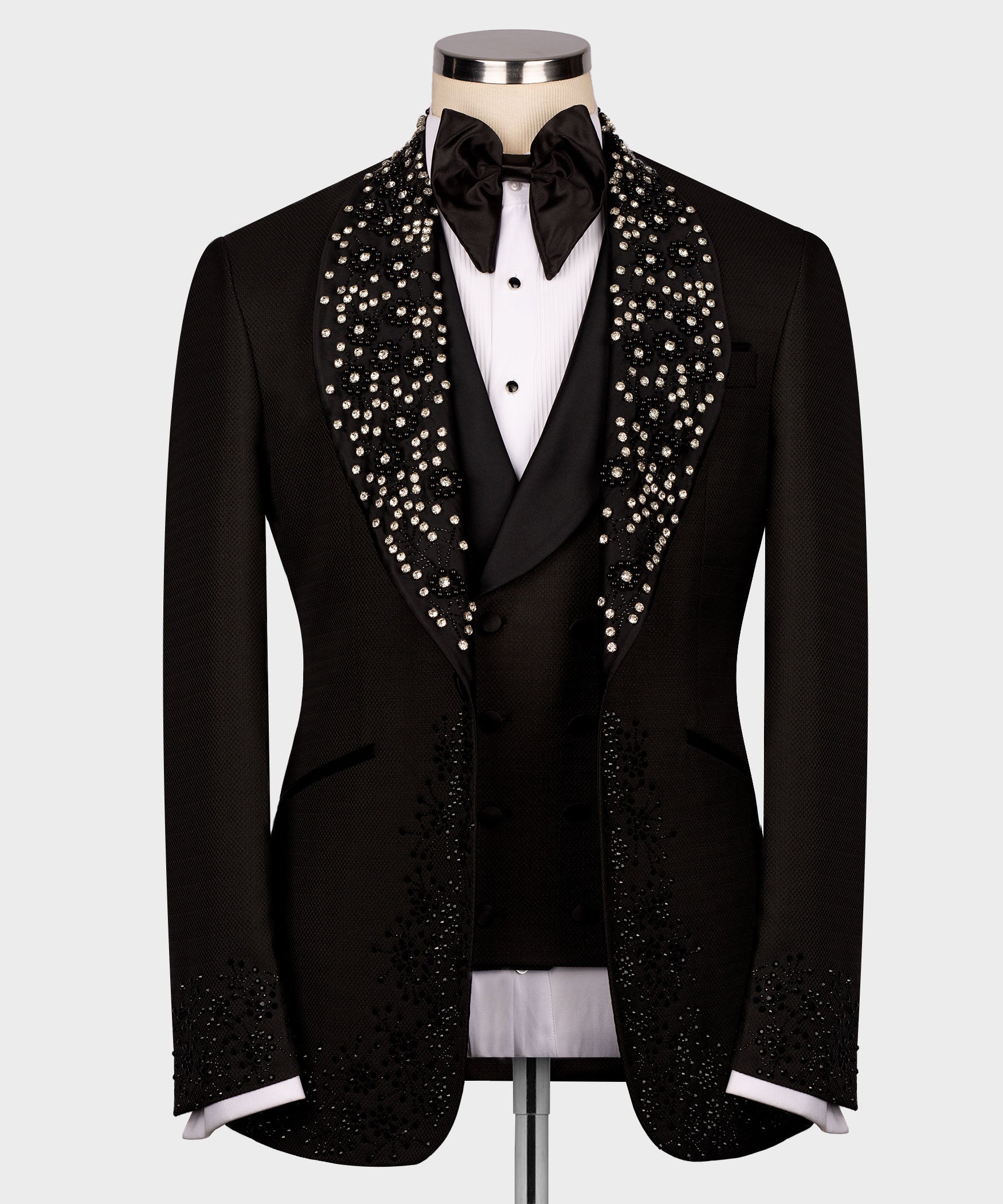 Black tuxedo set with rhinestone lapels, black bow tie, and vest