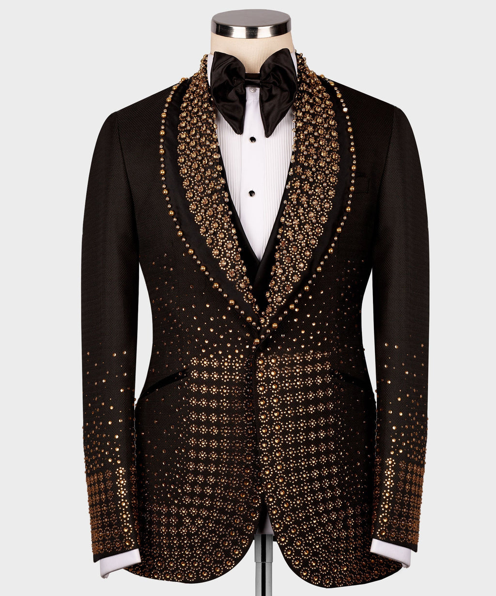 Black tuxedo jacket with dense gold gem-like trim on lapels and front panels, bow tie