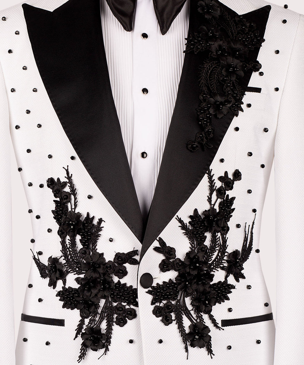Black floral embroidered motifs on white tuxedo lapels with black satin edge trim