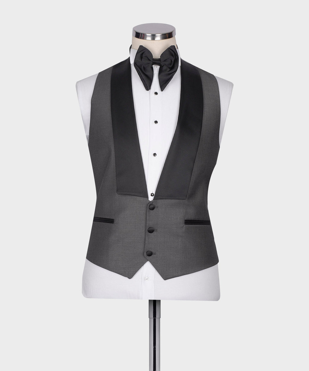 Charcoal gray tuxedo vest and jacket set with black bow tie over white dress shirt