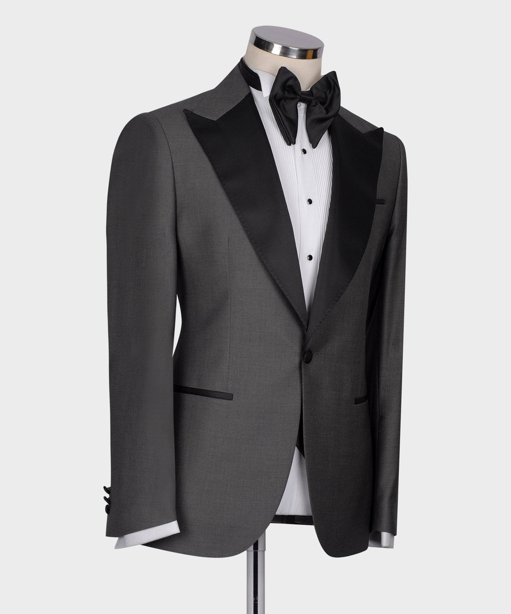 Charcoal gray tuxedo jacket with black bow tie and white dress shirt, front view