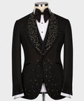Black tuxedo jacket with jeweled lapel trim, bow tie, and rhinestone front panels
